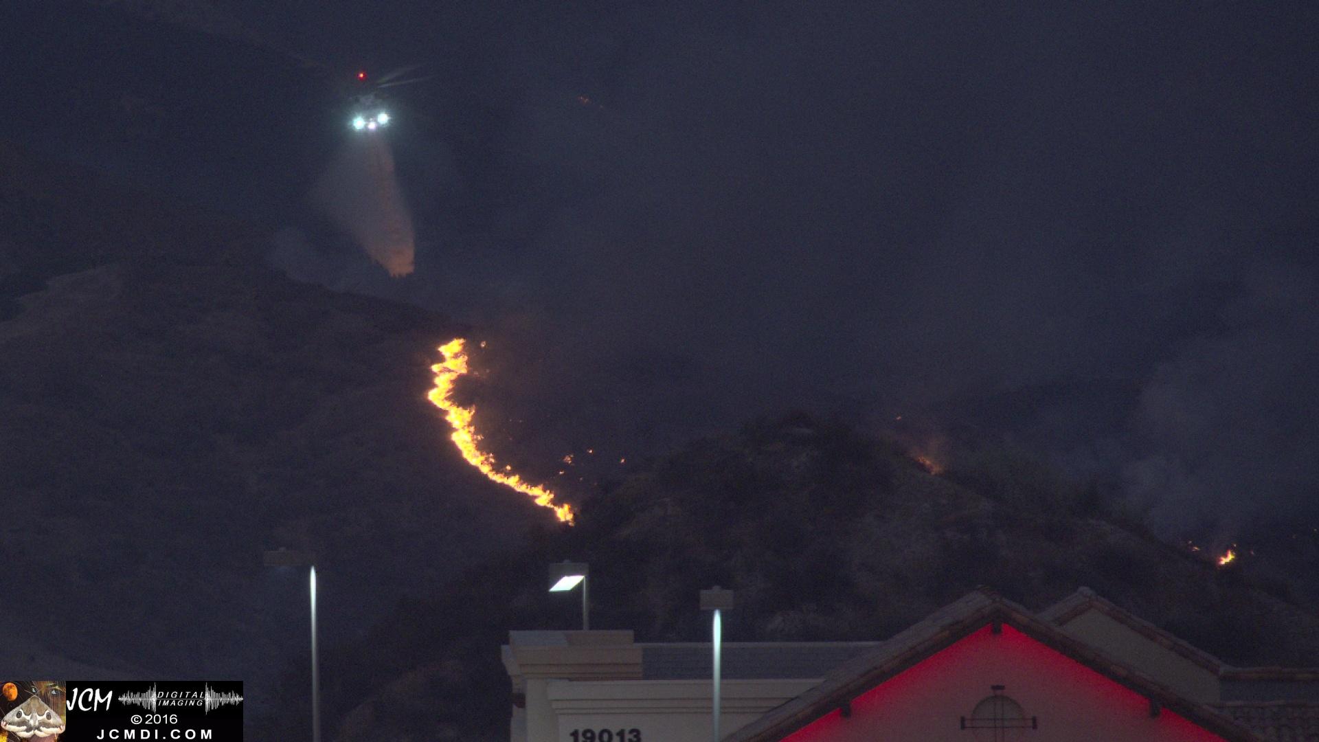 firehawk helicopter drops water at dusk at Sand Fire, Fair Oaks 7-24-2016 JCMDI.COM